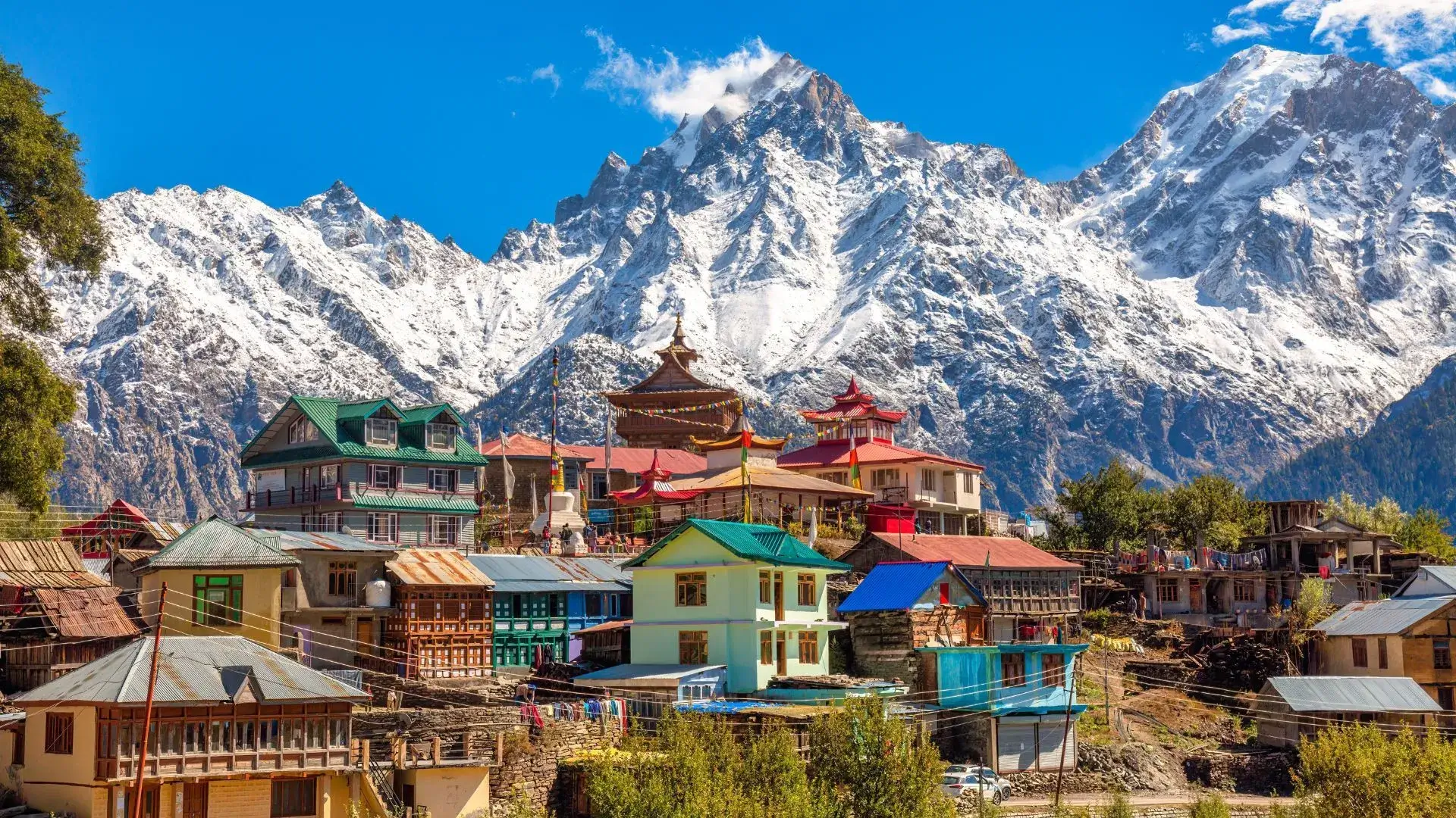 A Kinnaur village below snow-covered Himalayan peaks