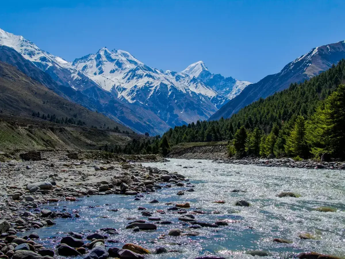 A Himachali hill town below snow-covered peaks